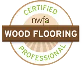 A circular badge with "CERTIFIED" and "PROFESSIONAL" in green, "nwfa" at the center, and a brown banner across the middle reading "WOOD FLOORING," ideal for those seeking wood floor refinishing near me.
