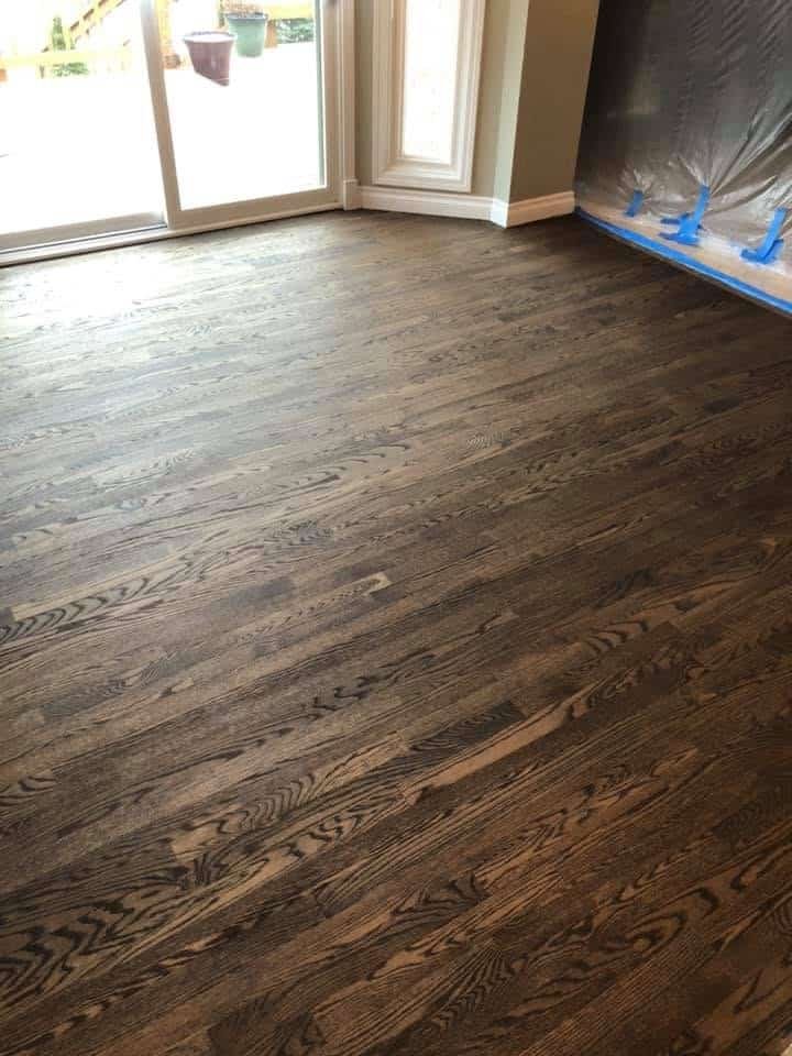 Newly refinished dark hardwood floors in a Metro Detroit living room